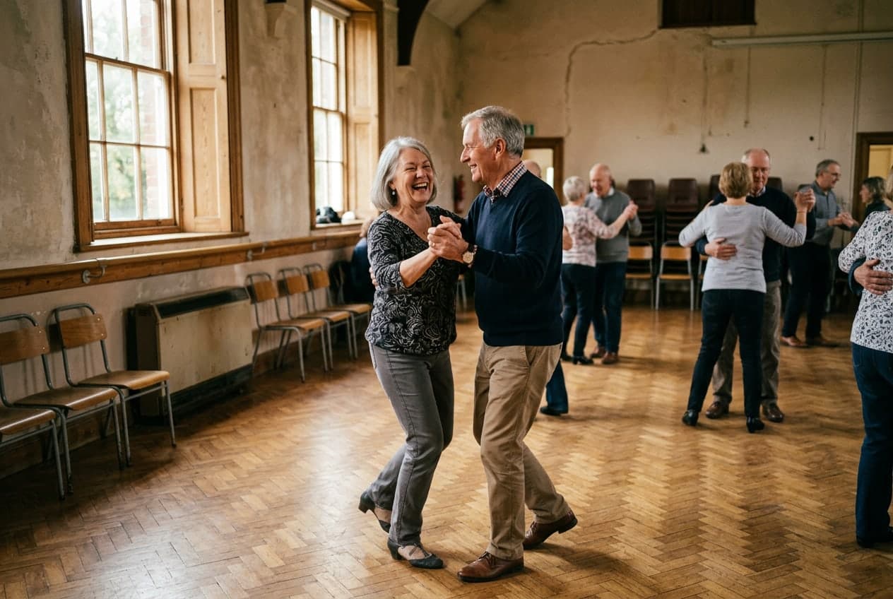 A couple ballroom dancing and laughing together