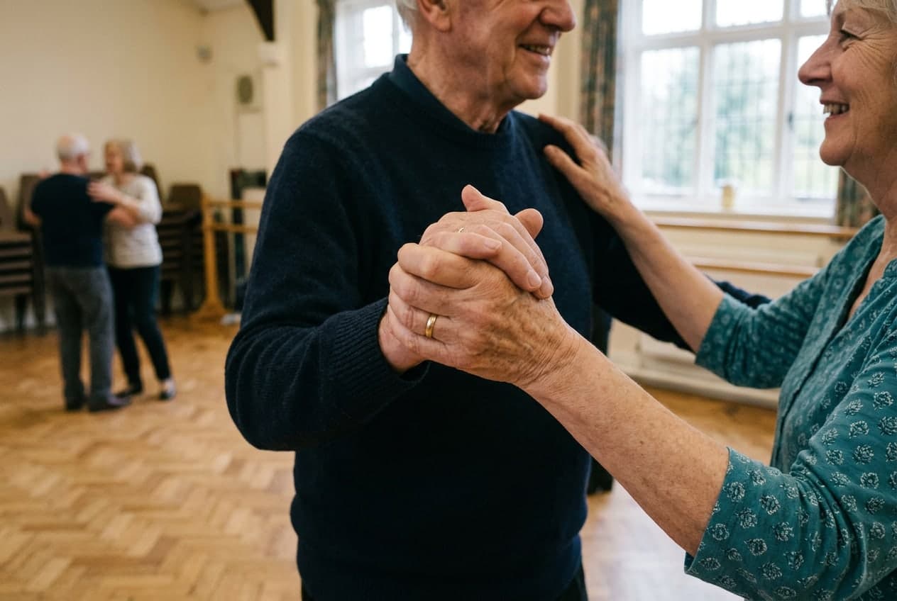 The clasped hands of a ballroom dancing couple in hold
